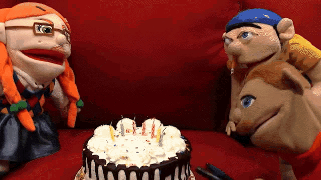 three stuffed animals are celebrating a birthday with a cake