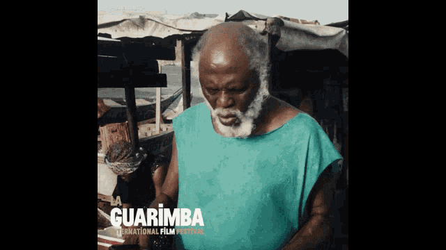 a poster for la guarimba international film festival shows a man in a green shirt
