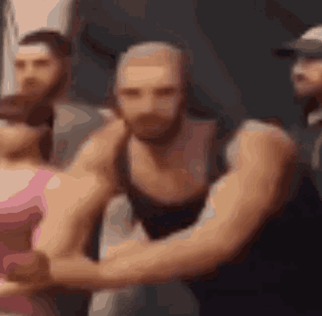 a blurry picture of a man with a beard standing next to a woman .