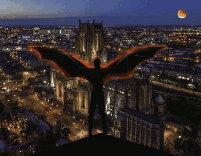 an aerial view of a city at night with a bat flying in the foreground