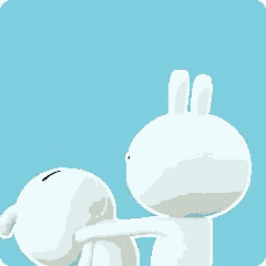 a couple of white rabbits are kissing each other