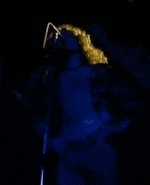 a poster for stairway to heaven tm shows a woman holding a microphone