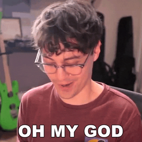 a man wearing glasses and a red shirt says oh my god .