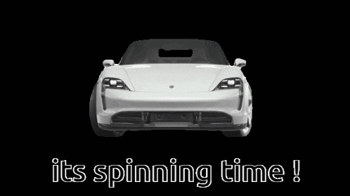 a white car with the words " its spinning time " written on it
