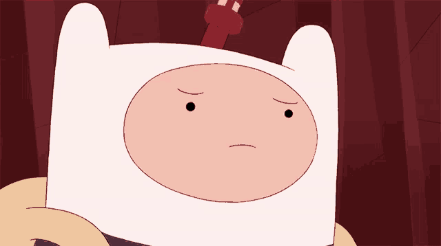 a cartoon character with a sad face and a red hat