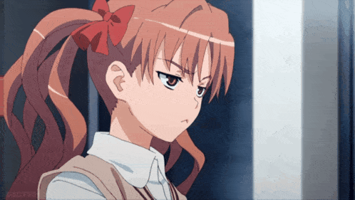 a girl with a ponytail and a red bow in her hair is looking at the camera