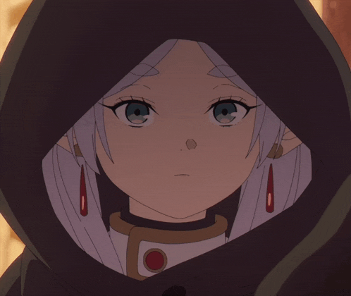 a close up of a girl with a hood on
