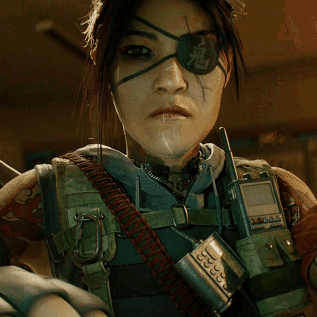 a woman with a bandage on her eye is holding a walkie talkie and a cell phone