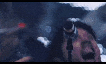 a man is flying through the air with a drum set in the foreground