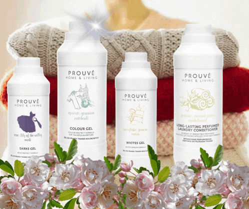four bottles of prouve home & living products are displayed in front of flowers