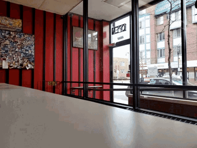 a restaurant with red walls and a pepsi sign