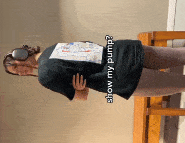 a woman wearing headphones and a t-shirt that says " show my pump "