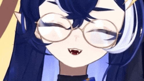 a close up of a girl wearing glasses and making a funny face .