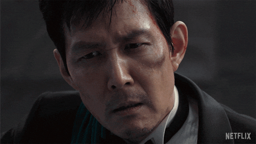 a close up of a man 's face with the word netflix on the bottom right