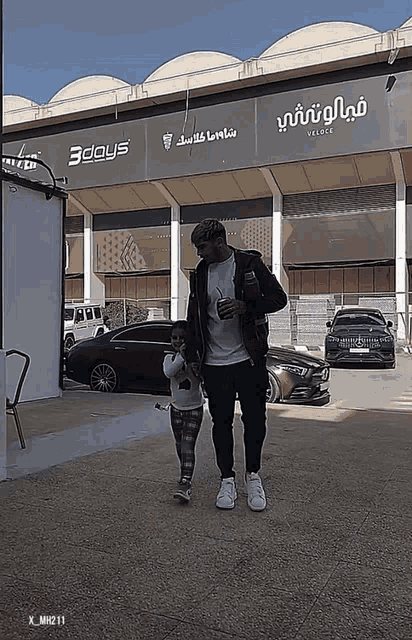 a man and a child are walking in front of a building that says 3 days