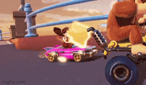 donkey kong is driving a pink car in a video game while a cartoon character is riding a pink car .