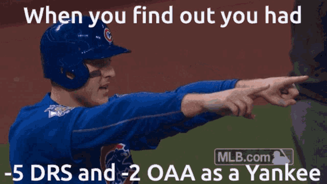a baseball player is pointing to a yankee player