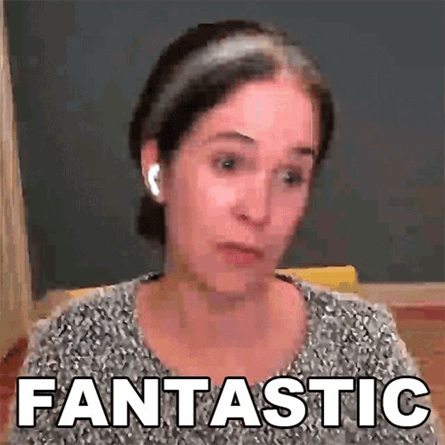 a woman wearing ear buds says fantastic