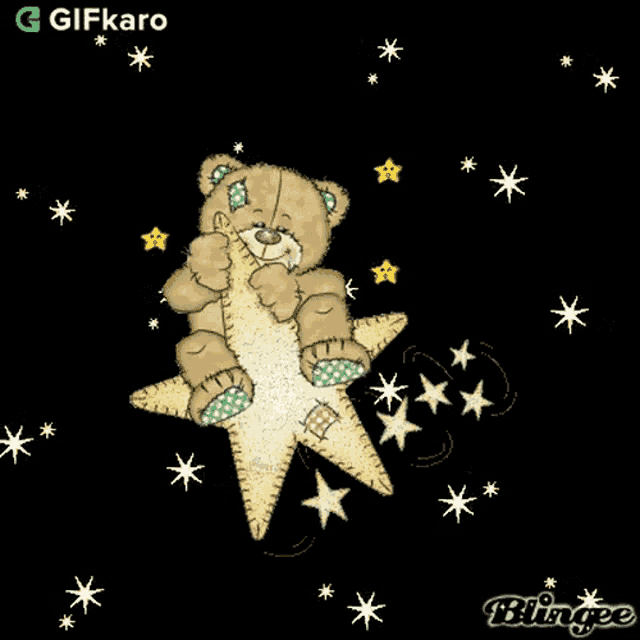 a teddy bear is sitting on top of a star with a gifkaro logo in the corner