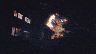 a dark room with a light coming out of the corner