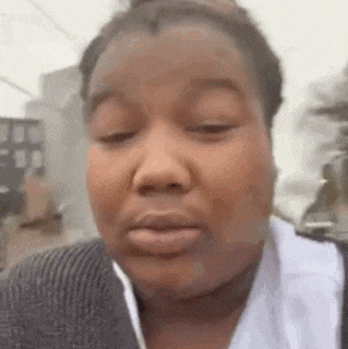 a close up of a woman with her eyes closed .