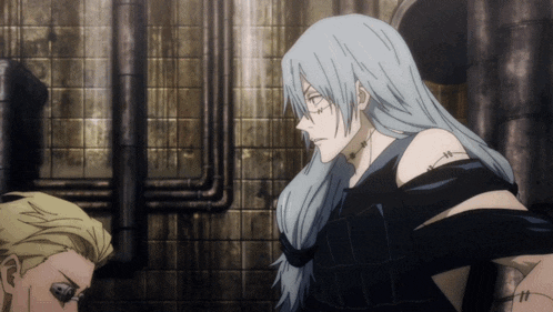 a man with long white hair has stitches on his chest and shoulder