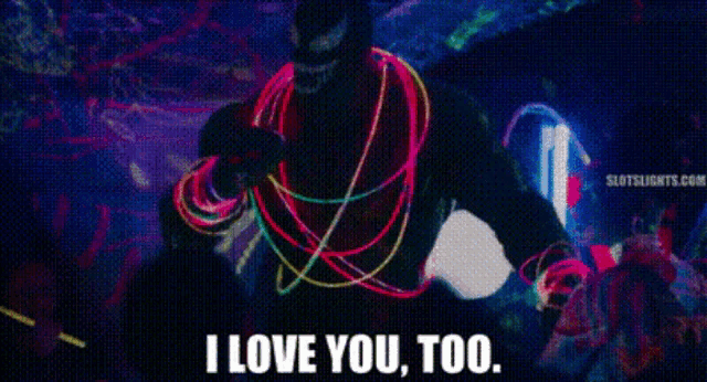 a man in glow in the dark clothes is dancing and saying i love you too