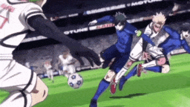 a group of soccer players are playing soccer on a field in a stadium .