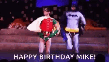 a robin and a batman are running on a stage .