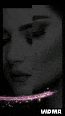 a black and white photo of a woman 's face with vidma written in white