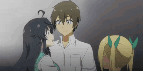 a man and a woman are standing next to each other in a dark room .