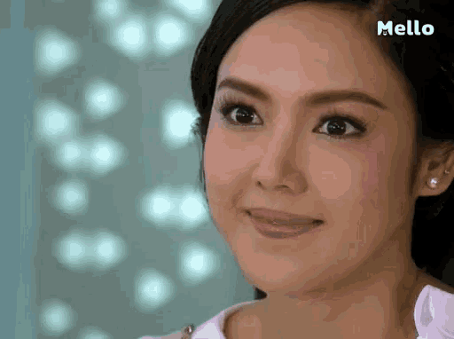a close up of a woman 's face with the word mello on the bottom