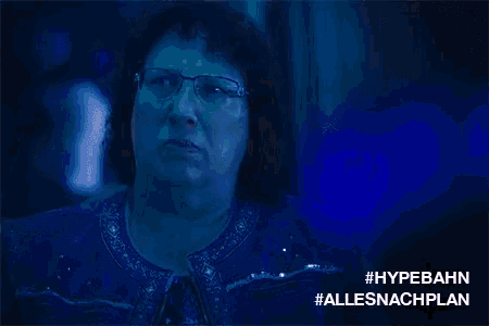 a woman wearing glasses and a denim jacket with #hypebahn allesnachplan