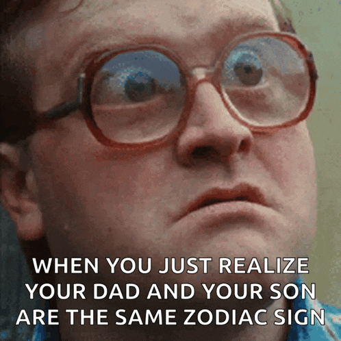 a man wearing glasses is making a funny face