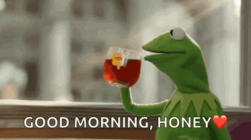 kermit the frog is holding a cup of tea and says good morning honey