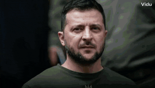 a man with a beard is wearing a t-shirt that says n4