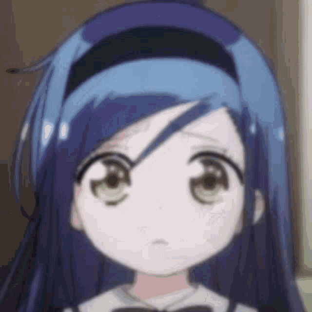 a close up of a girl 's face with blue hair and a headband .