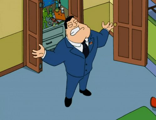 a man in a suit is standing in front of a door