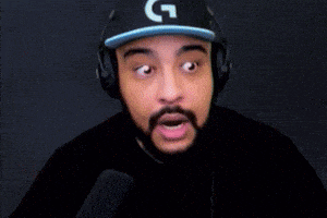 a man wearing a hat with a g on it