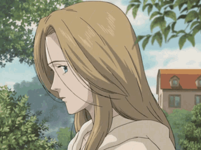 a woman with long blonde hair and blue eyes is standing in front of a building