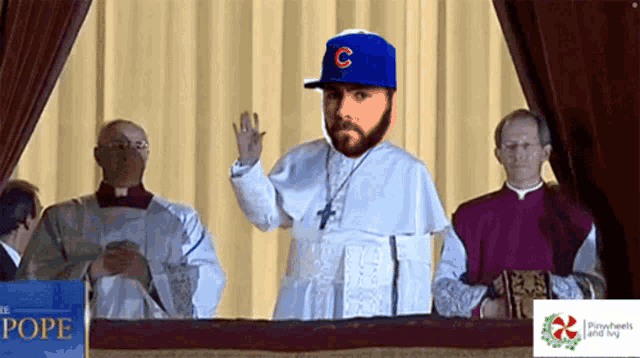a man in a baseball cap with the letter c on his head