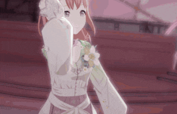 a girl in a white dress is holding flowers in her hand .