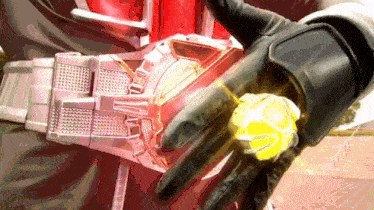 a close up of a person 's hand with a yellow object in it