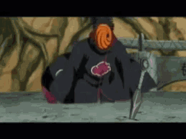 a cartoon character is holding a sword and wearing a mask with a cloud on it .