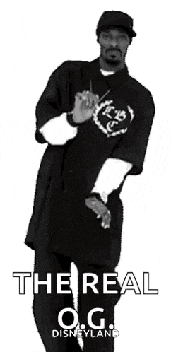 snoop dogg is wearing a black shirt that says the real o.g.
