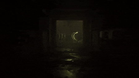 a dark room with a glowing circle in the middle of it