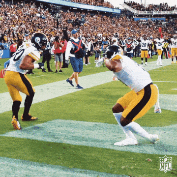 two football players on the field with the nfl logo in the background