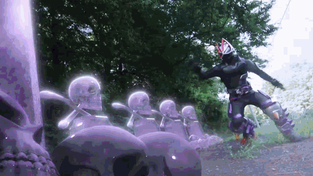 a man in a fox mask is standing in front of a row of skulls