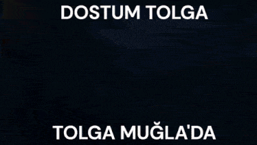a close up of a person 's hand with the words dostum tolga tolga mugla 'da