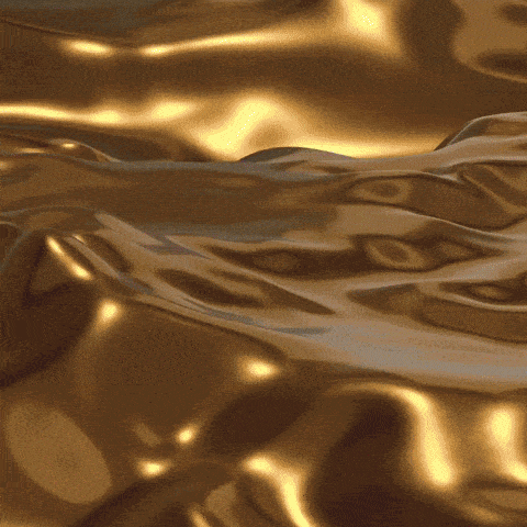 a close up of a gold surface with a black frame
